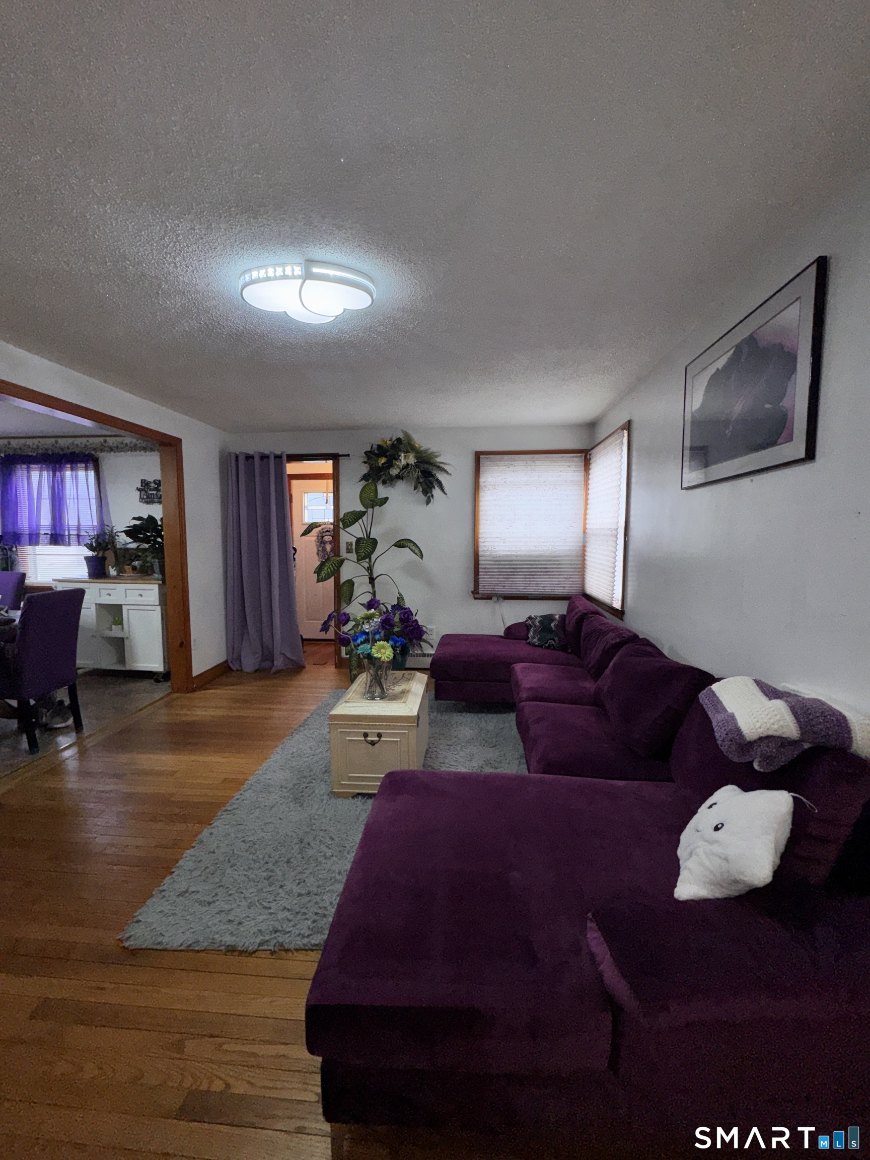 45 Lawrence Street Vernon, CT 06066 - Photo 3 of 17 a living room with furniture and a wooden floor
