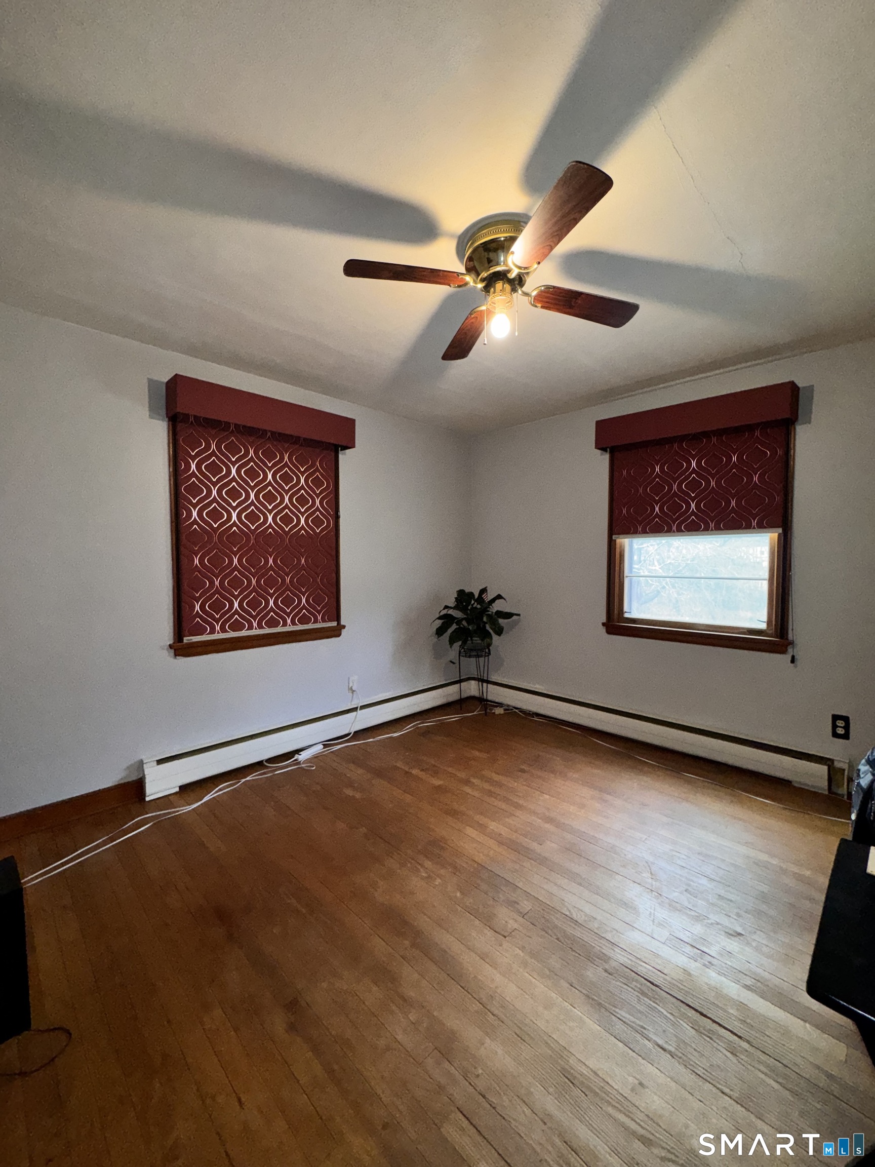 45 Lawrence Street Vernon, CT 06066 - Photo 6 of 17 a view of an empty room with a window