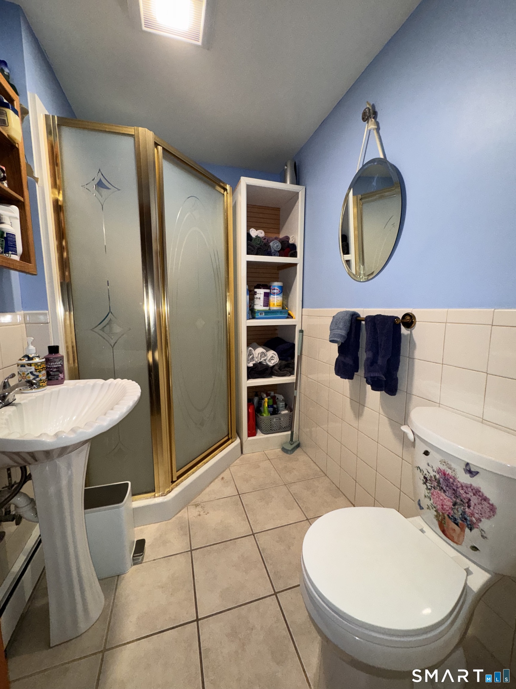 45 Lawrence Street Vernon, CT 06066 - Photo 7 of 17 a bathroom with a toilet sink and mirror