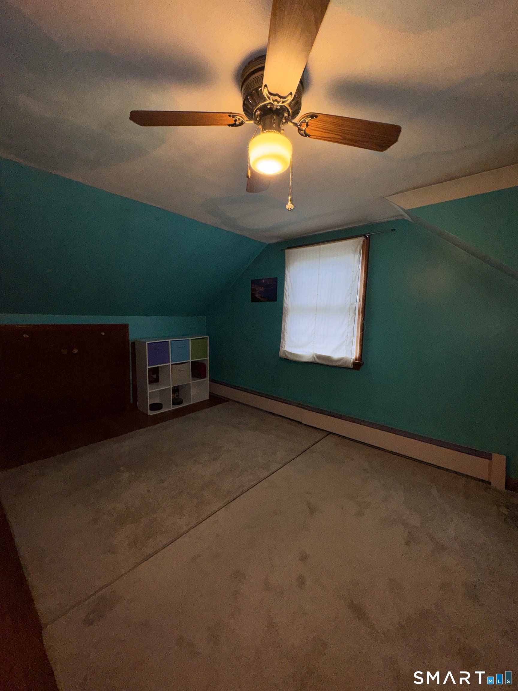 45 Lawrence Street Vernon, CT 06066 - Photo 8 of 17 a living room with furniture and a ceiling fan