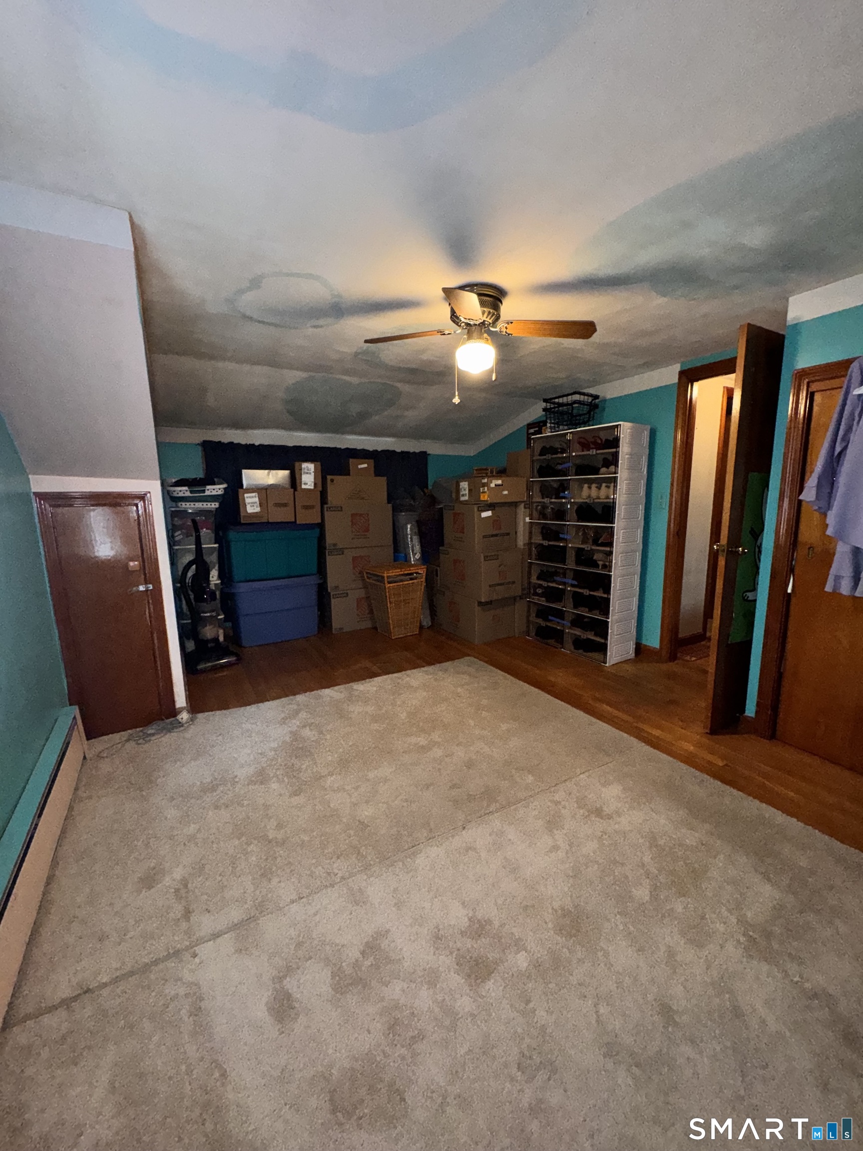45 Lawrence Street Vernon, CT 06066 - Photo 9 of 17 a view of a livingroom with furniture and a ceiling fan