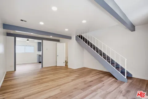 a view of an entryway with wooden floor