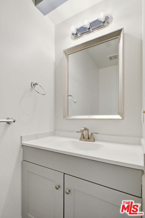 622 West Regent Street, Unit 5 Inglewood, CA 90301 - Photo 6 of 16 a bathroom with a sink and a mirror