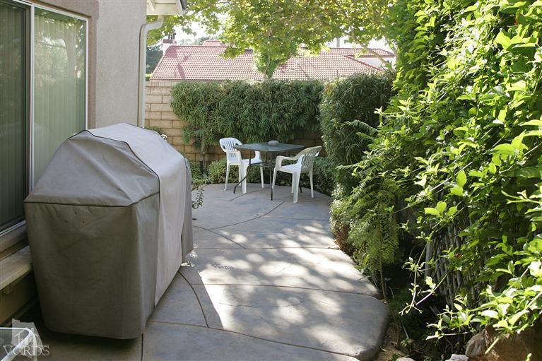 2005 Tulip Avenue Simi Valley, CA 93063 - Photo 11 of 14 a view of a patio with table and chairs and potted plants