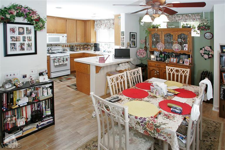 2005 Tulip Avenue Simi Valley, CA 93063 - Photo 5 of 14 a view of a dining room with furniture and wooden floor