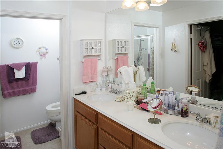 2005 Tulip Avenue Simi Valley, CA 93063 - Photo 7 of 14 a bathroom with a sink double vanity and a toilet