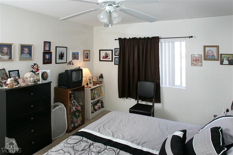 2005 Tulip Avenue Simi Valley, CA 93063 - Photo 8 of 14 a bedroom with furniture and a window