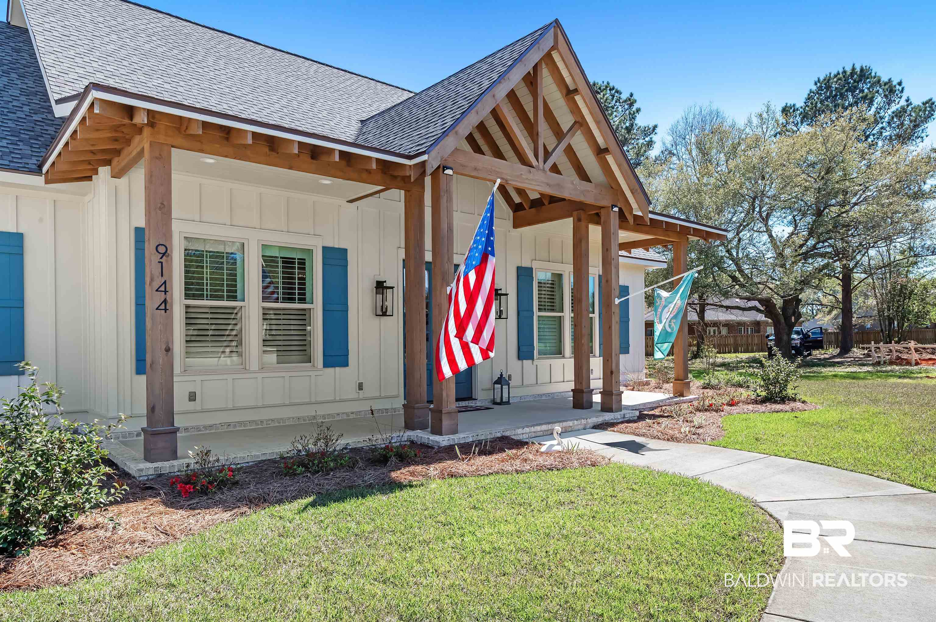 9144 Harvest Ridge Fairhope, AL 36532 - Photo 4 of 58 View of front of property with covered porch, board and batten siding, and a shingled roof