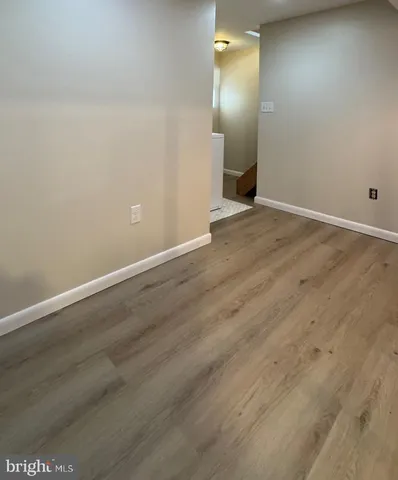 an empty room with wooden floor