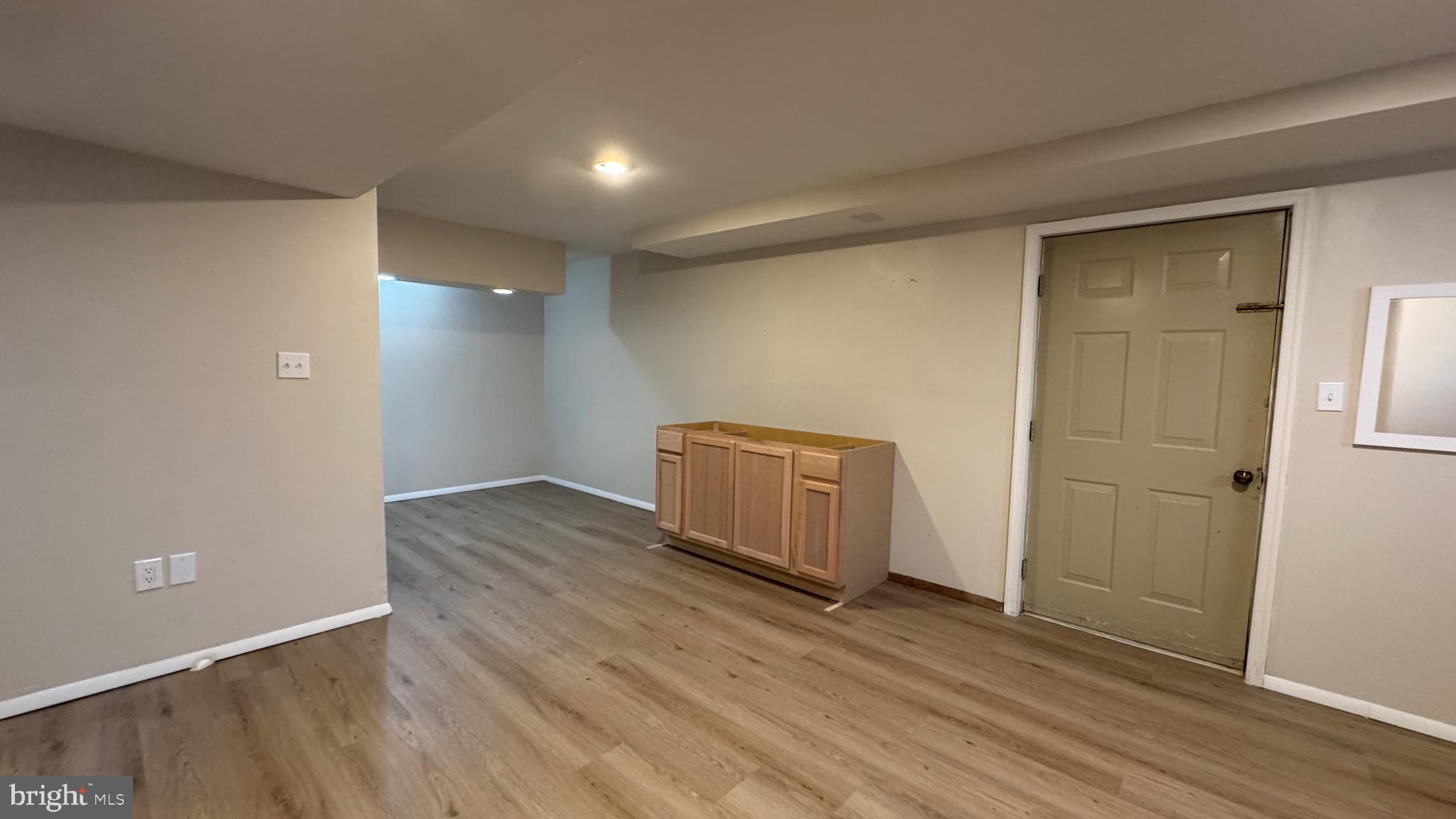 18817 Kerill Road Triangle, VA 22172 - Photo 18 of 23 an empty room with wooden floor and windows