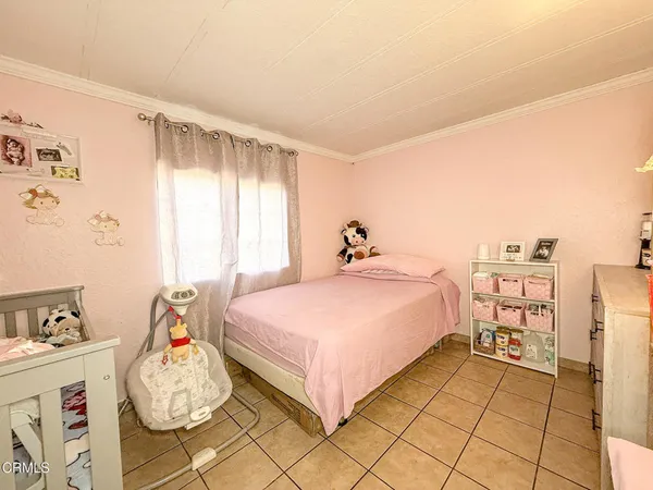 a bed room with a bed and a window