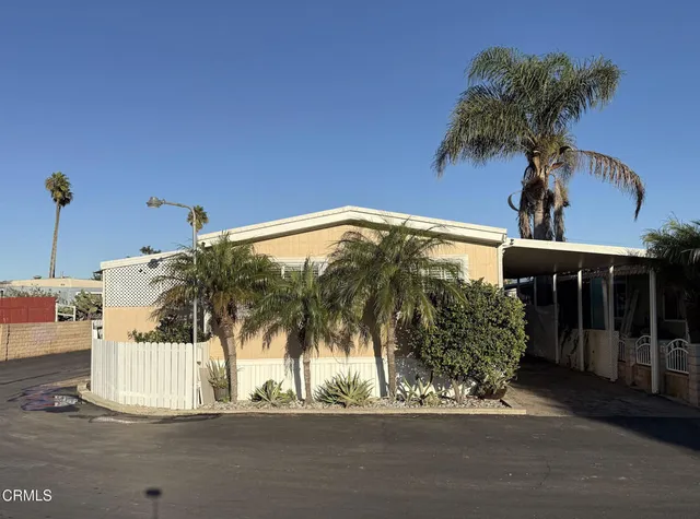 a view of a house with a yard and garage