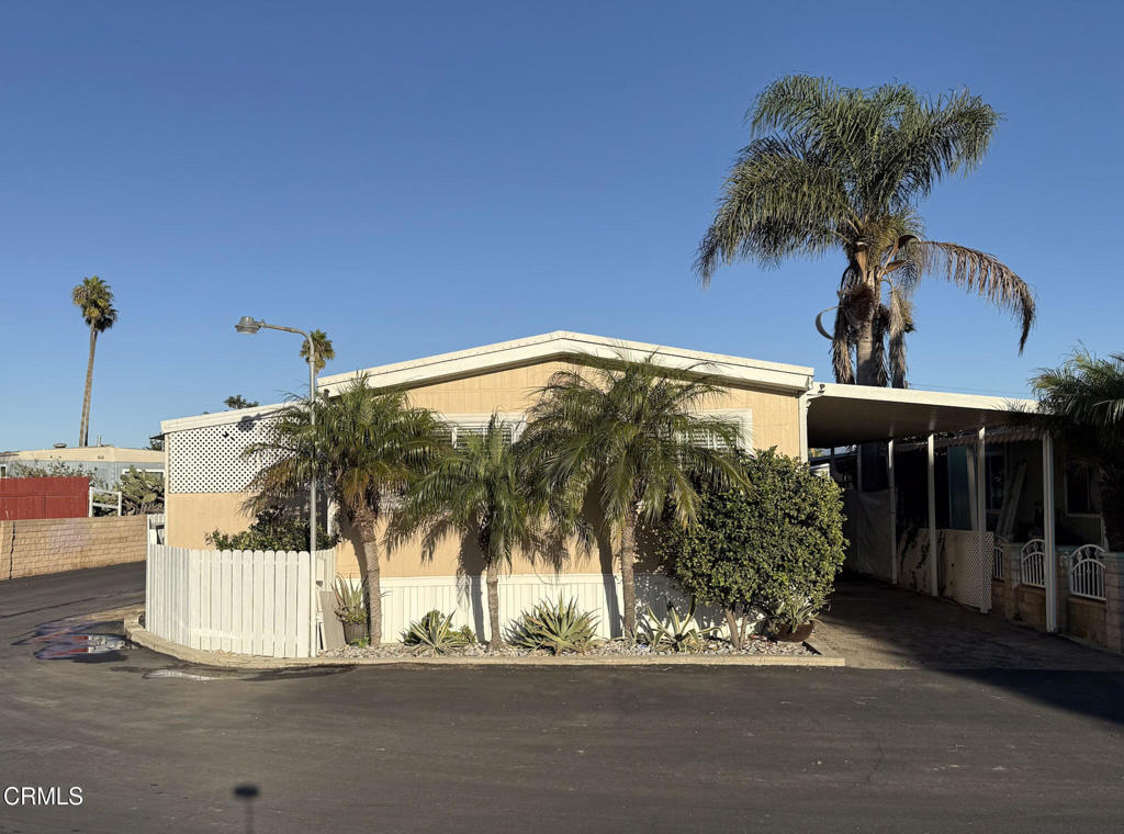 4108 Ranchita Lane Oxnard, CA 93033 - Photo 17 of 19 a view of a house with a yard and garage