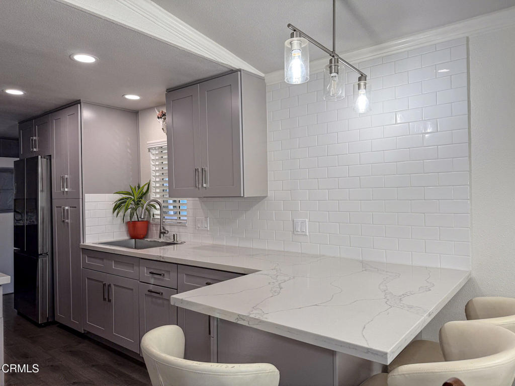 4108 Ranchita Lane Oxnard, CA 93033 - Photo 2 of 19 a bathroom with a sink a toilet and mirror