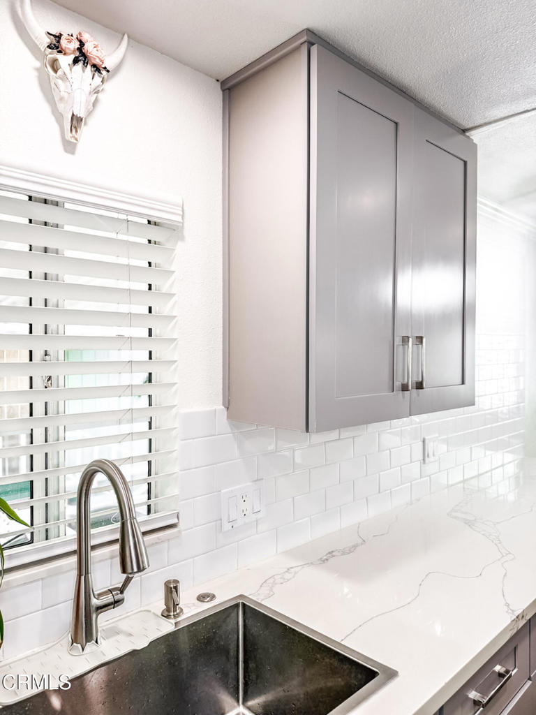 4108 Ranchita Lane Oxnard, CA 93033 - Photo 4 of 19 a bathroom with a sink and a large mirror