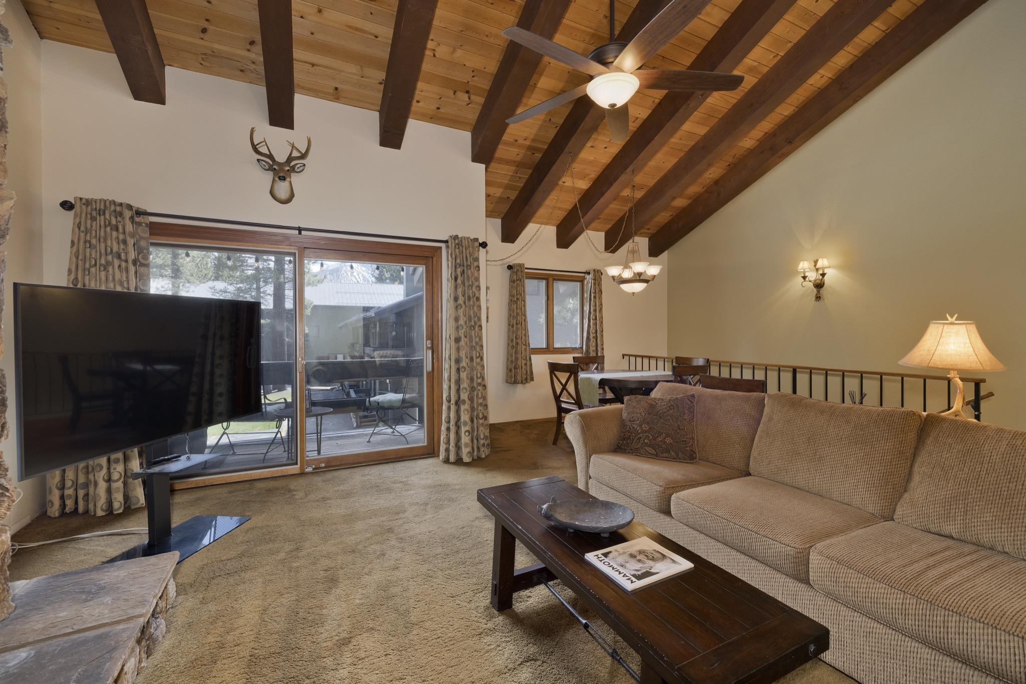 484 Manzanita Road, Unit 16 Mammoth Lakes, CA 93546 - Photo 11 of 34 a living room with furniture and a flat screen tv
