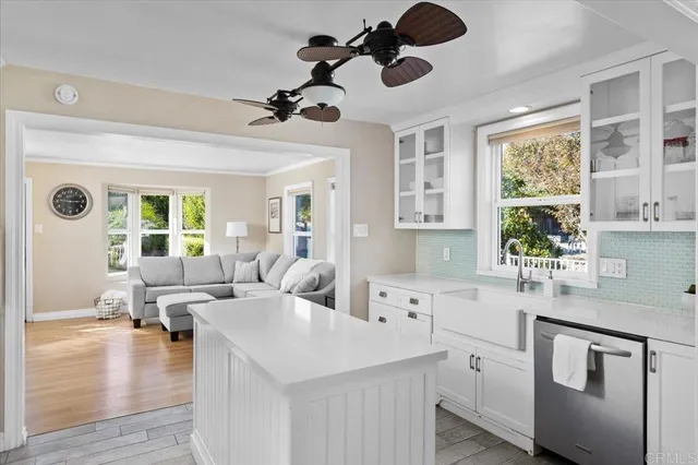 a kitchen with stainless steel appliances granite countertop a refrigerator and a stove