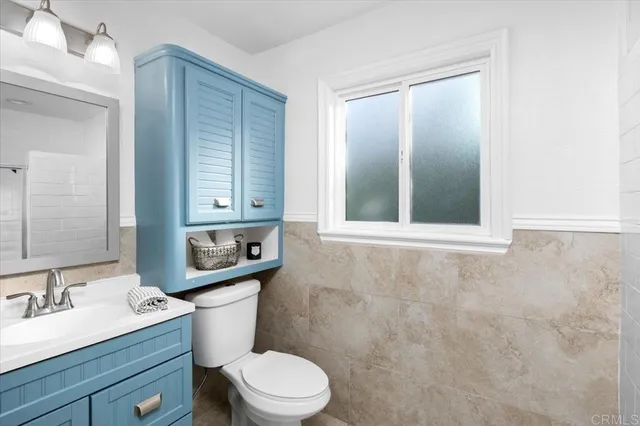 a bathroom with a glass shower door