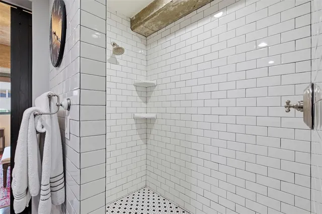 a kitchen with a refrigerator and cabinets