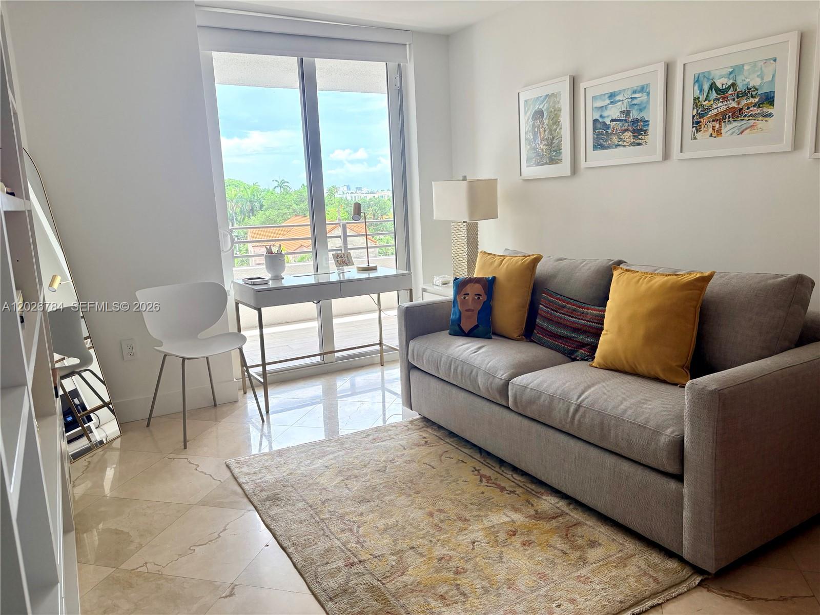 151 Southeast 15th Road, Unit 601 Miami, FL 33129 - Photo 26 of 36 a living room with furniture and a large window