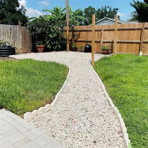 a backyard of a house with lots of green space