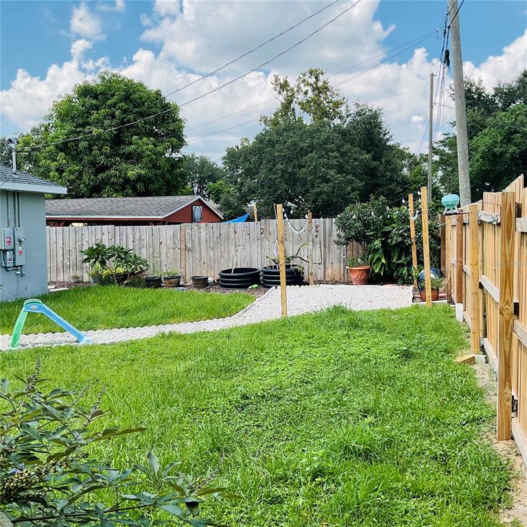 515 5th Street South Dundee, FL 33838 - Photo 15 of 74 a view of a house with backyard and a tree
