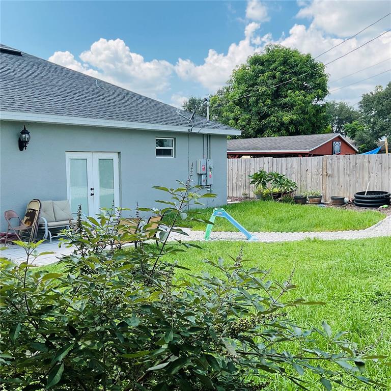 515 5th Street South Dundee, FL 33838 - Photo 16 of 74 a backyard of a house with table and chairs