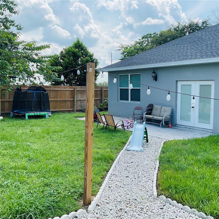 515 5th Street South Dundee, FL 33838 - Photo 18 of 74 a view of a house with backyard sitting area and garden
