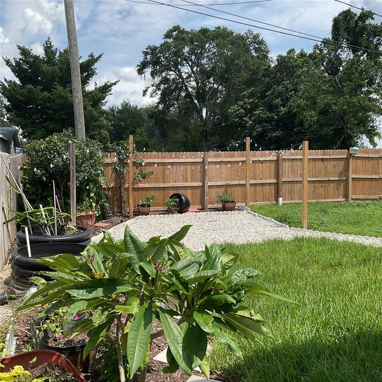 515 5th Street South Dundee, FL 33838 - Photo 21 of 74 a view of yard with swimming pool and trees