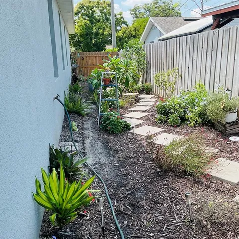 a bedroom with a bed and two mirror