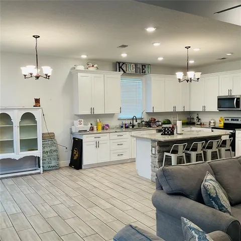 a hallway with front door wooden floor and furniture