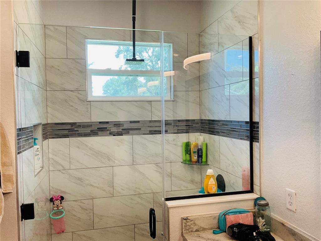 515 5th Street South Dundee, FL 33838 - Photo 35 of 74 a bathroom with a sink and a mirror