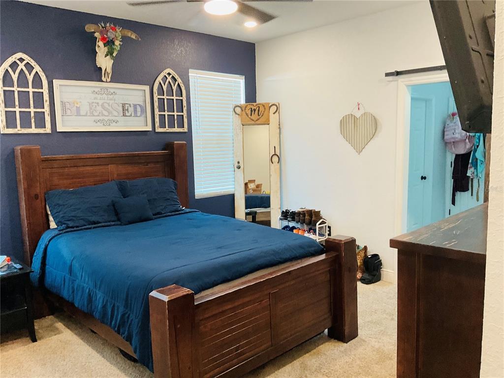 515 5th Street South Dundee, FL 33838 - Photo 42 of 74 a bedroom with a bed and two mirror