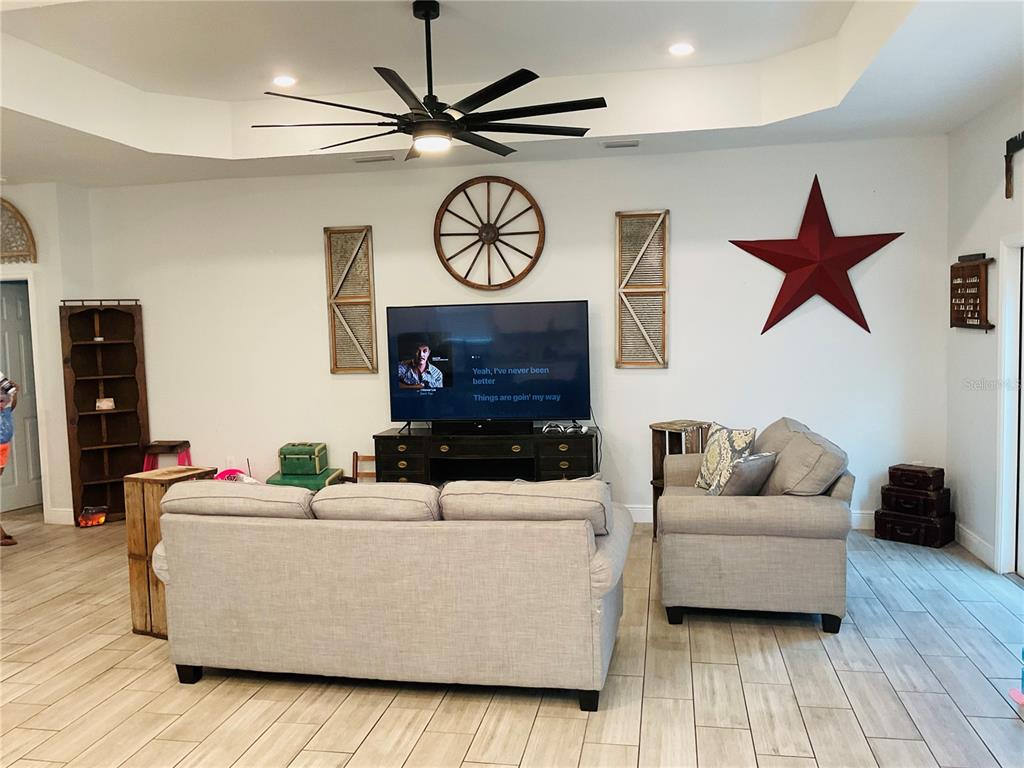 515 5th Street South Dundee, FL 33838 - Photo 51 of 74 a living room with furniture and a flat screen tv