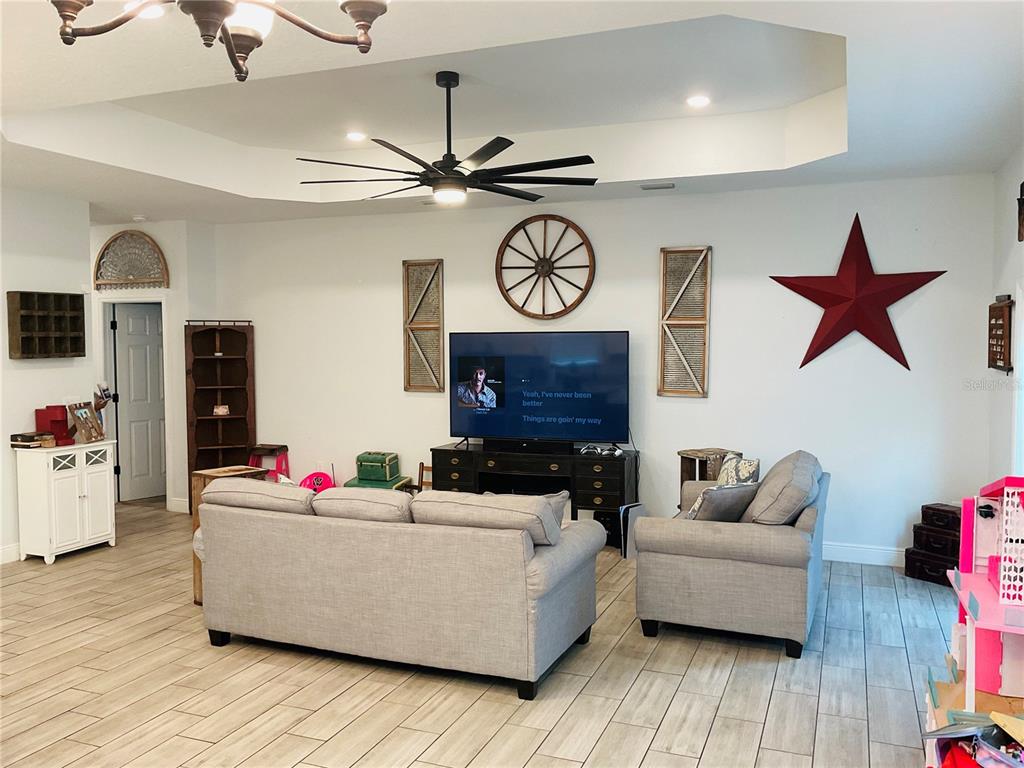 515 5th Street South Dundee, FL 33838 - Photo 52 of 74 a living room with furniture and wooden floor