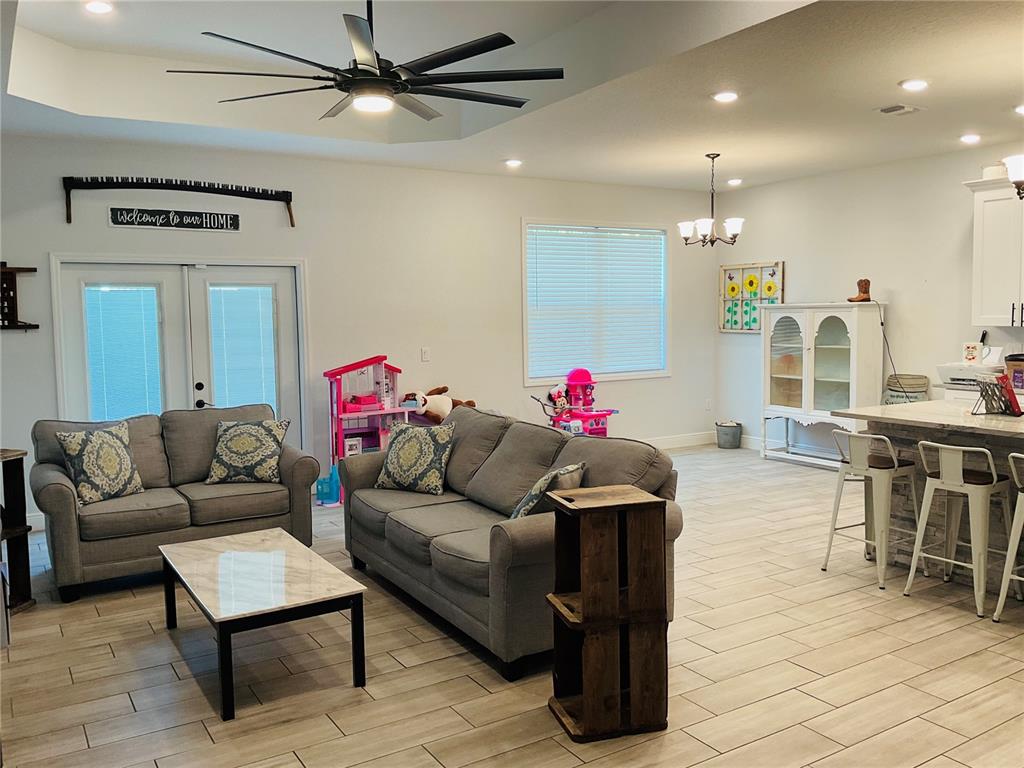 515 5th Street South Dundee, FL 33838 - Photo 63 of 74 a living room with furniture and kitchen view