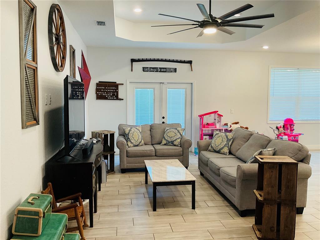 515 5th Street South Dundee, FL 33838 - Photo 64 of 74 a living room with furniture and a flat screen tv