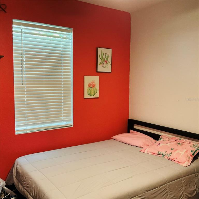 515 5th Street South Dundee, FL 33838 - Photo 7 of 74 a bedroom with a bed and a window