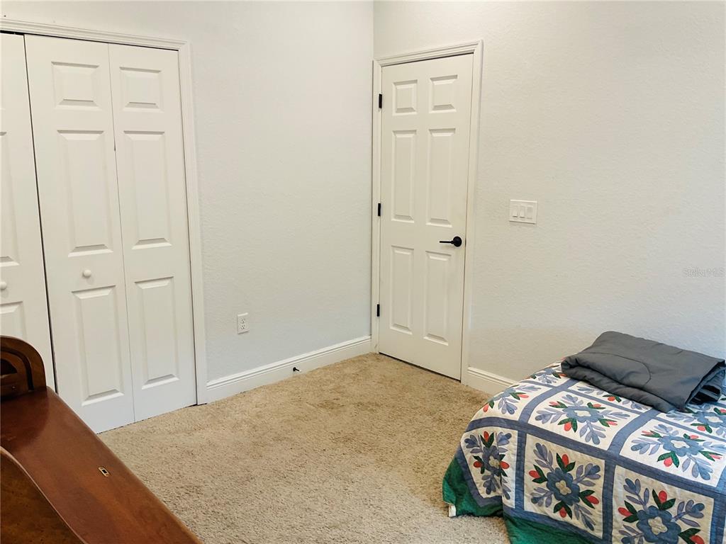 515 5th Street South Dundee, FL 33838 - Photo 71 of 74 a bedroom with a bed and a dresser