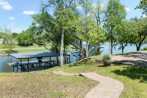 a view of a swimming pool with a patio