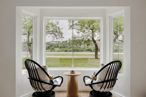 a view of a dining room with furniture window and outside view