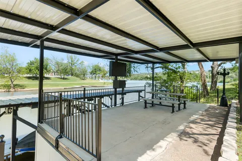 a view of a porch with chairs and backyard