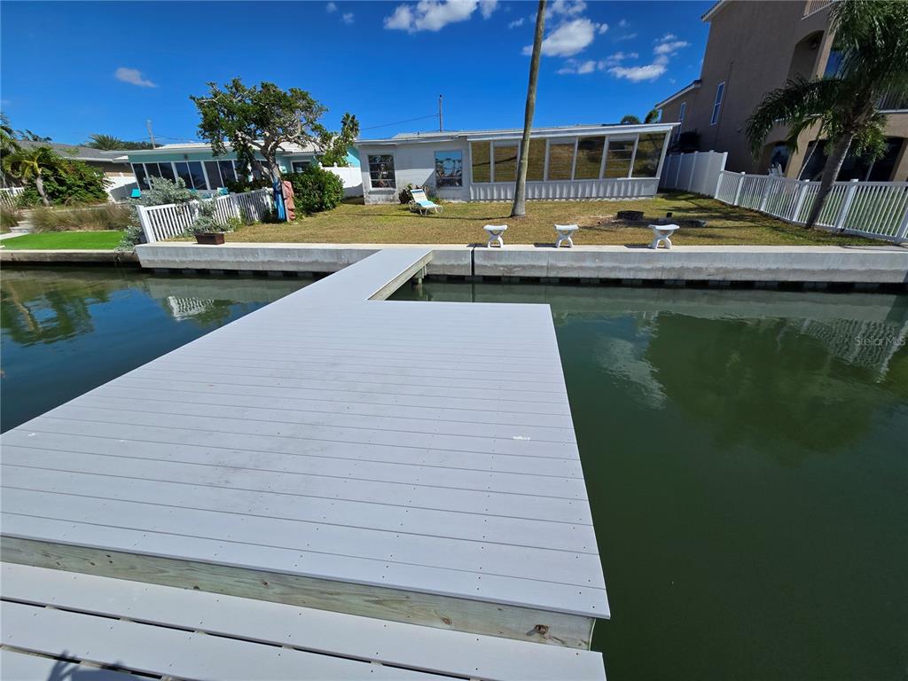 530 Lillian Drive Madeira Beach, FL 33708 - Photo 15 of 56 a view of swimming pool with outdoor seating and lake view