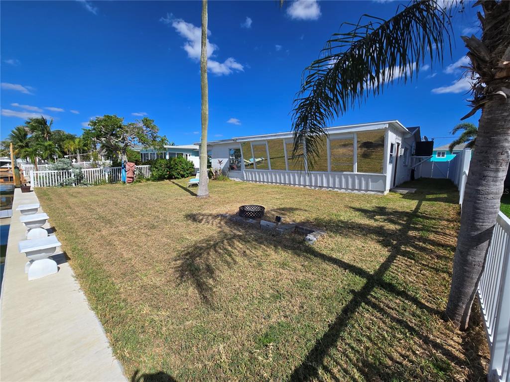 530 Lillian Drive Madeira Beach, FL 33708 - Photo 17 of 56 a view of a backyard