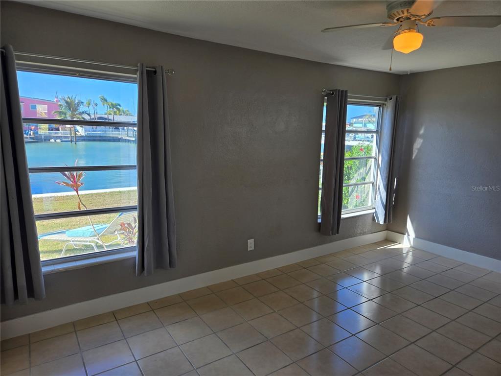 530 Lillian Drive Madeira Beach, FL 33708 - Photo 21 of 56 an empty room with windows