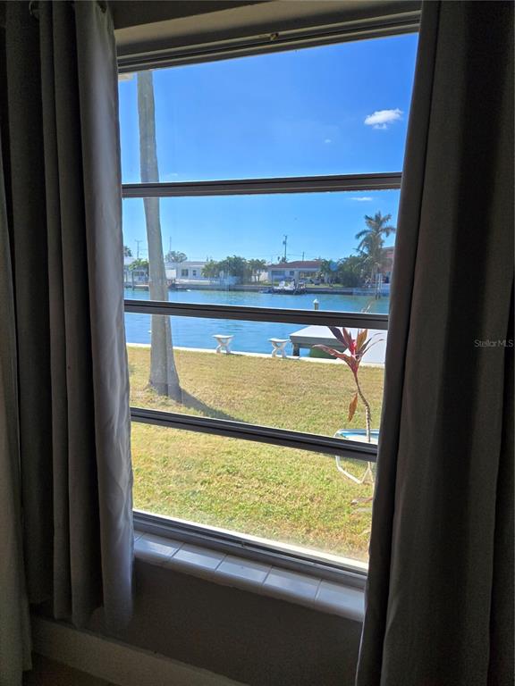 530 Lillian Drive Madeira Beach, FL 33708 - Photo 29 of 56 a view of a glass door with a window