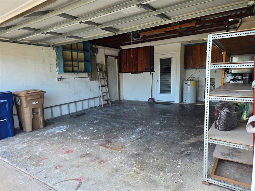 530 Lillian Drive Madeira Beach, FL 33708 - Photo 44 of 56 a view of a hallway with entryway and chandelier