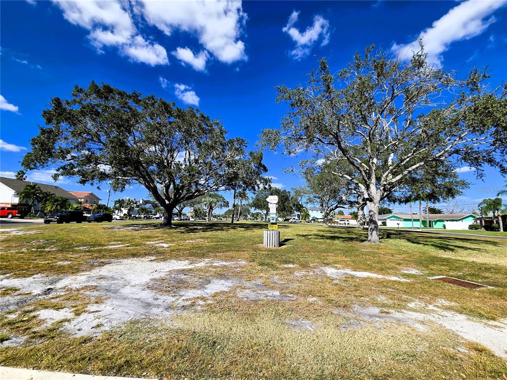 530 Lillian Drive Madeira Beach, FL 33708 - Photo 48 of 56 a view of a swimming pool with an outdoor space and seating area