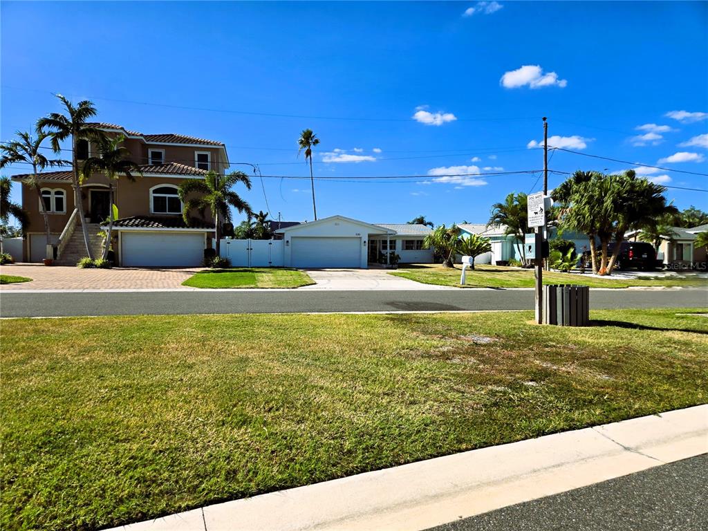 530 Lillian Drive Madeira Beach, FL 33708 - Photo 51 of 56 a view of a house with a yard