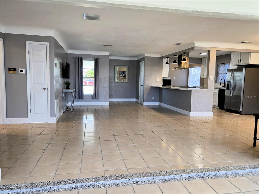 530 Lillian Drive Madeira Beach, FL 33708 - Photo 10 of 56 a view of a living room and kitchen
